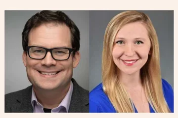 Man with glasses smiling and woman smiling