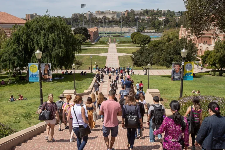 crowd of people walking down Janss Steps