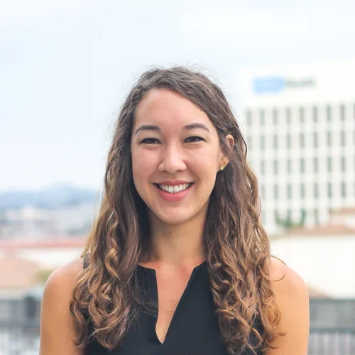 Kristen is pictured here smiling.