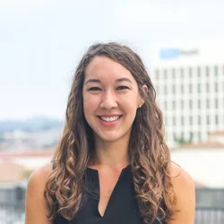 Kristen is pictured here smiling.