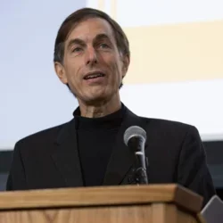 Steven Wallace talking at a podium. 